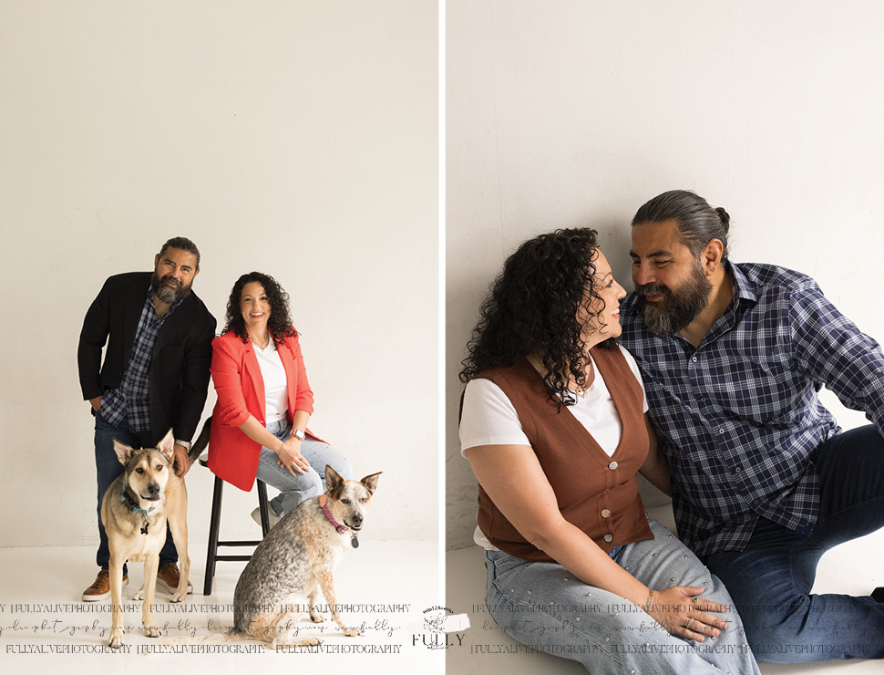 couple in a studio with their dogs enjoying a family photoshoot