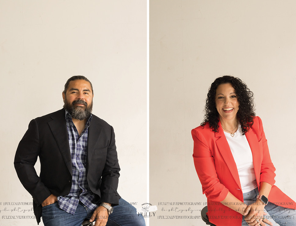 couple in a studio with their dogs enjoying a family photoshoot